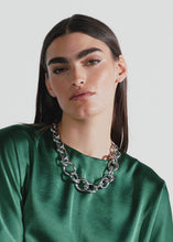 Load and play video in Gallery viewer, Riani Satin Blouse with Knot Detail in Clover
